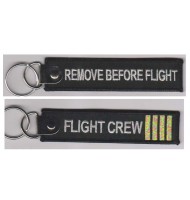 Black remove before flight keychain